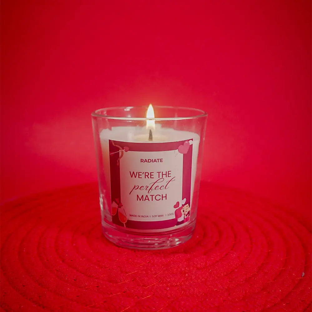 Radiate's We're a perfect match scented candle in a transparent jar with scent of cherry blossom