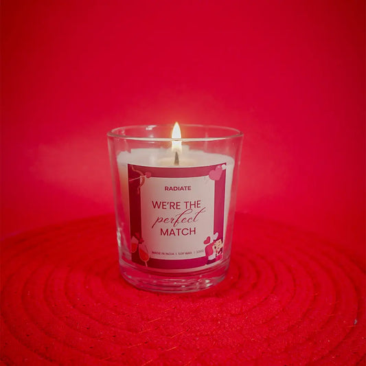 Radiate's We're a perfect match scented candle in a transparent jar with scent of cherry blossom