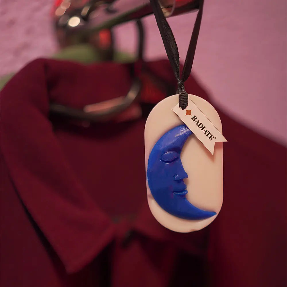 Moon wax sachet hanging in a closet.