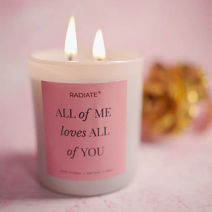 Radiate's 'All of me loves all of you' lotus, honeysuckle and cashmere musk scented candle on a pink background