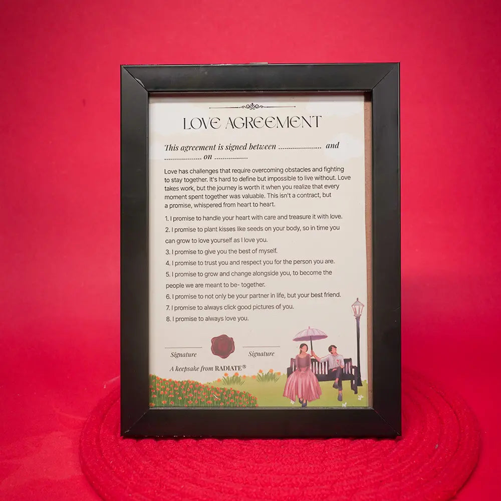 Framed playful 'Love Agreement' for couples by Radiate on a red background