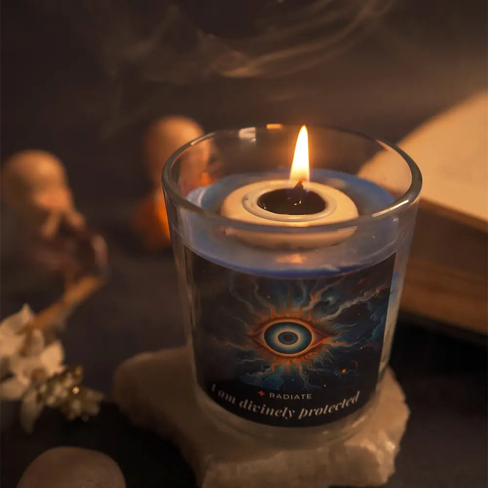 Evil eye candle with Jasmine, Sandalwood and Loban scent top view burning on a dark surface. 