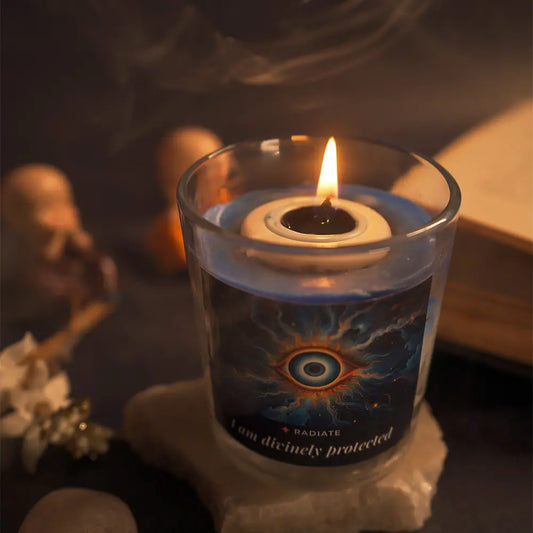 Evil eye candle with Jasmine, Sandalwood and Loban scent top view burning on a dark surface. 